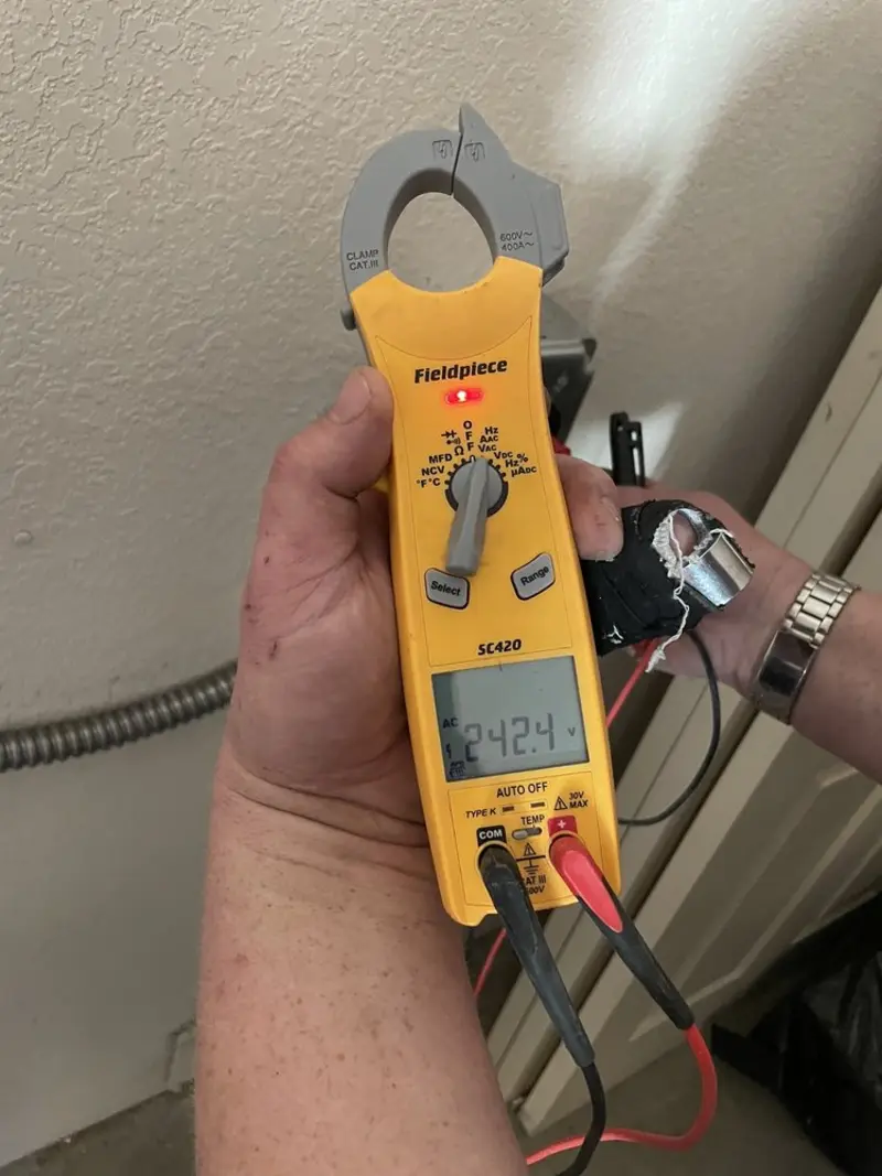 Voltage testing with clamp meter during Outlet Installation in Truth or Consequences